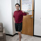Person working out in a room with a 3 ft. Unilateral Loop with Handle Green Medium Resistance attached to a door standing in room